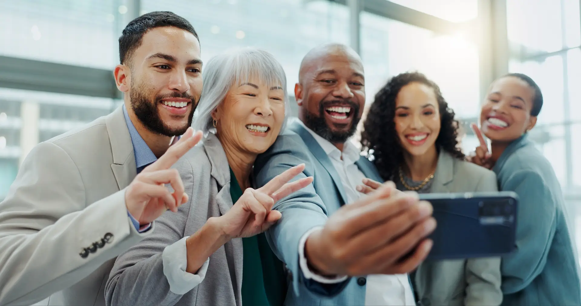 Happy business people, peace sign and office selfie for photography, team building or social media.